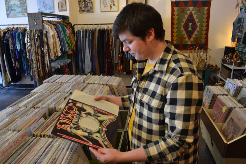 Leveret's Jesse Gertz takes in the glitz and grammar of Disco compilations at Moody Lords located at 566 Congress St. in Portland. Photo Credit: Kevin Steeves